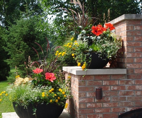 Flower pots on outdoor fireplace