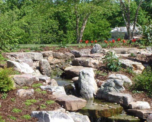 Water feature surrounded by large stones
