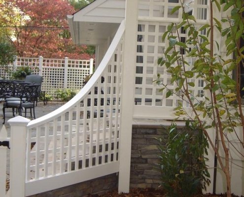 White woodwork lattice screen accenting stairs
